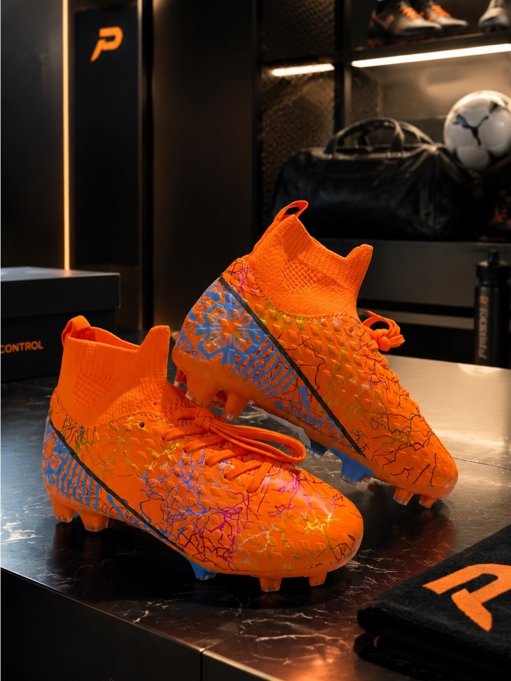 Kids Orange High-Top Soccer Cleats with Graphic Detail
